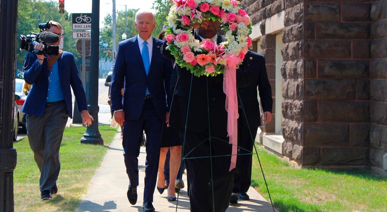 Former Vice President and presidential candidate Joe Biden, center left, joins Sen. Doug Jones and Birmingham Mayor Randall Woodfin at a wreath laying after a service at 16th Street Baptist Church in Birmingham, Ala. (Ivana Hrynkiw/The Birmingham News via Former Vice President and presidential candidate Joe Biden, center left, joins Sen. Doug Jones and Birmingham Mayor Randall Woodfin at a wreath laying after a service at 16th Street Baptist Church in Birmingham, Ala. (Ivana Hrynkiw/The Birmingham News via