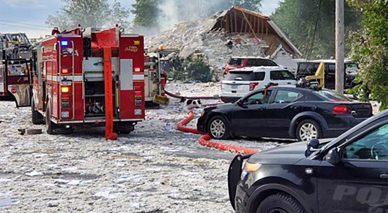 Emergency vehicles are at the scene of a deadly propane explosion, Monday, Sept. 16, 2019, which leveled new construction in Farmington, Maine.