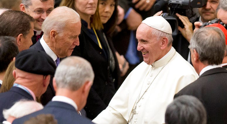 In this April 29, 2016, file photo, Vice President Joe Biden shakes hands with Pope Francis during a congress on the progress of regenerative medicine held at the Vatican. (AP Photo/Andrew Medichini, File)