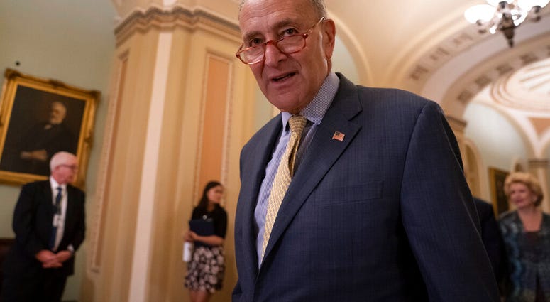 Senate Minority Leader Chuck Schumer, D-N.Y., arrives to speak to reporters at a news conference at the Capitol in Washington, Tuesday, Sept. 17, 2019. (AP Photo/J. Scott Applewhite)