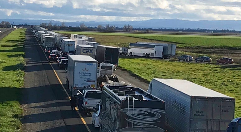 This Feb. 14, 2019, photo released by Caltrans District 3 shows a 7-mile back up on the South bound Interstate 5, as it reopens to traffic in Maxwell in Colusa County, Calif.