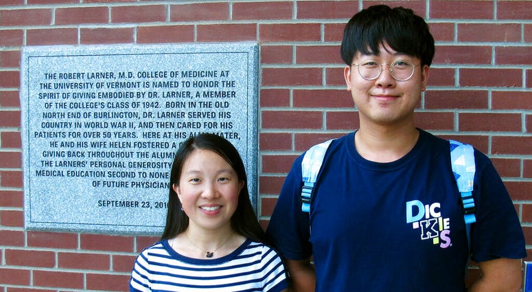In this photo Aug. 16, 2019, photo, Chinese graduate students Zhaojin Li, left, and Pengfei Liu, pose in front of the entrance to the Robert Larner College of Medicine at the University of Vermont in Burlington, Vt. (AP Photo/Wilson Ring) In this photo Aug. 16, 2019, photo, Chinese graduate students Zhaojin Li, left, and Pengfei Liu, pose in front of the entrance to the Robert Larner College of Medicine at the University of Vermont in Burlington, Vt. (AP Photo/Wilson Ring)