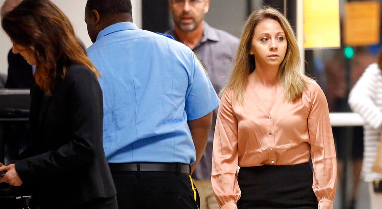 FILE - In this Sept. 13, 2019 file photo, fired Dallas police Officer Amber Guyger, right, arrives for jury selection in her murder trial at the Frank Crowley Courthouse in downtown Dallas. (Tom Fox/The Dallas Morning News via AP File) FILE - In this Sept. 13, 2019 file photo, fired Dallas police Officer Amber Guyger, right, arrives for jury selection in her murder trial at the Frank Crowley Courthouse in downtown Dallas. (Tom Fox/The Dallas Morning News via AP File)