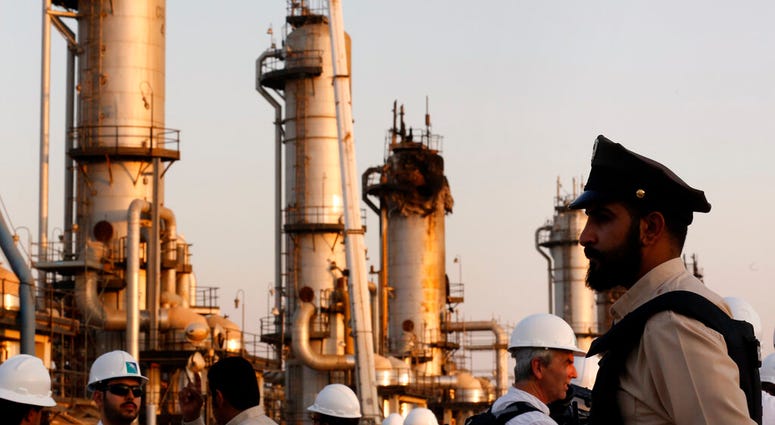 During a trip organized by Saudi information ministry, a security guarder stands alert in front of Aramco's oil processing facility after the recent Sept. 14 attack on Aramco's oil processing facility in Abqaiq, near Dammam in the Kingdom's Eastern Provin
