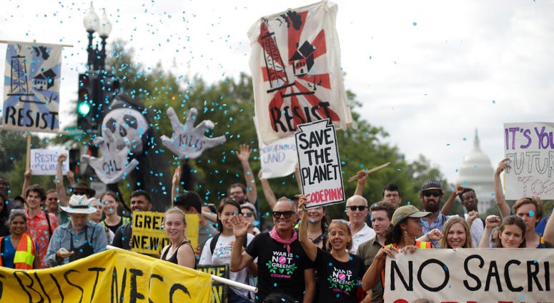 Protesters block traffic near the U.S. Capitol in Washington, Monday, Sept. 23, 2019. A broad coalition of climate and social justice organizations are disrupting the morning rush hour commute. (AP Photo/Pablo Martinez Monsivais) Protesters block traffic near the U.S. Capitol in Washington, Monday, Sept. 23, 2019. A broad coalition of climate and social justice organizations are disrupting the morning rush hour commute. (AP Photo/Pablo Martinez Monsivais)