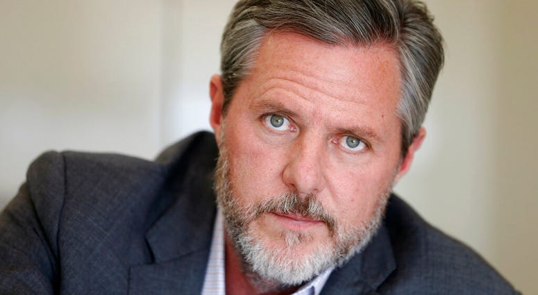 FILE - In this Nov. 16, 2016 file photo Liberty University president Jerry Falwell Jr., pauses during an interview in his office at the school in Lynchburg, Va.