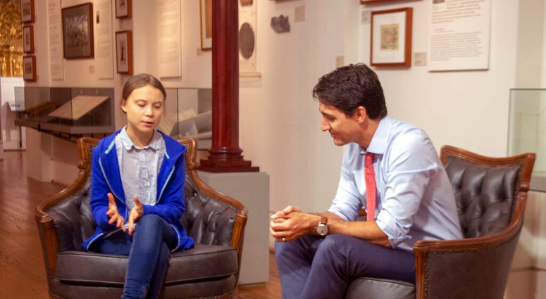Canadian Prime Minister Justin Trudeau speaks Swedish environmental activist Greta Thunberg in Montreal on Friday, Sept. 27, 2019.