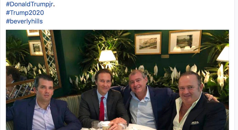 This Facebook screen shot provided by The Campaign Legal Center, shows from left, Donald Trump, Jr., Tommy Hicks, Jr., Lev Parnas and Igor Fruman, posted on May 21, 2018. (The Campaign Legal Center via AP)