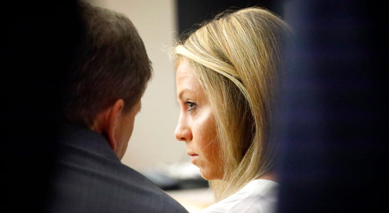 Former Dallas police officer Amber Guyger listens to her attorney Toby Shook during her trial at the Frank Crowley Courts Building in Dallas, Saturday, Sept. 28, 2019. (Tom Fox/The Dallas Morning News via AP, Pool)