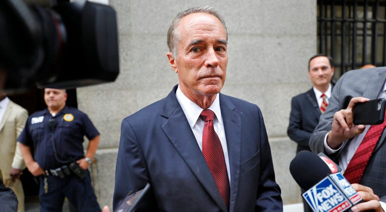 FILE - In this Sept. 12, 2019 file photo, U.S. Rep. Chris Collins, R-N.Y., speaks to reporters as he leaves the courthouse after a pretrial hearing in his insider-trading case, in New York.