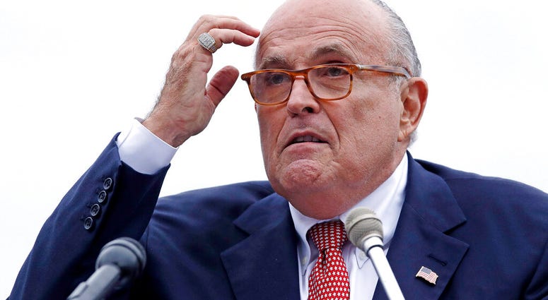 FILE - In this Aug. 1, 2018 file photo, Rudy Giuliani, attorney for President Donald Trump, addresses a gathering during a campaign event in Portsmouth, N.H. House committees have subpoena Giuliani for documents related to Ukraine.