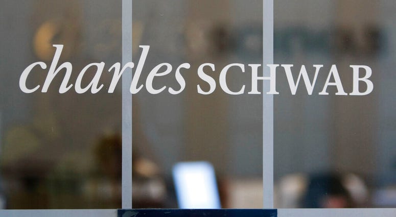 FILE - This July 14, 2010, file photo, shows a Charles Schwab office in Oakland, Calif. Charles Schwab is dropping commissions for online trading of U.S. stocks and exchange-traded funds, the latest slash in an industry battle that’s drastically cut the c