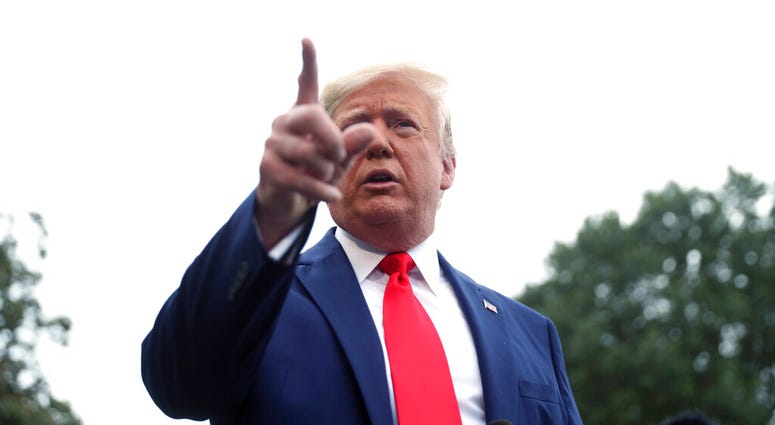 President Donald Trump speaks to members of the media on the South Lawn of the White House in Washington. (AP Photo/Andrew Harnik)