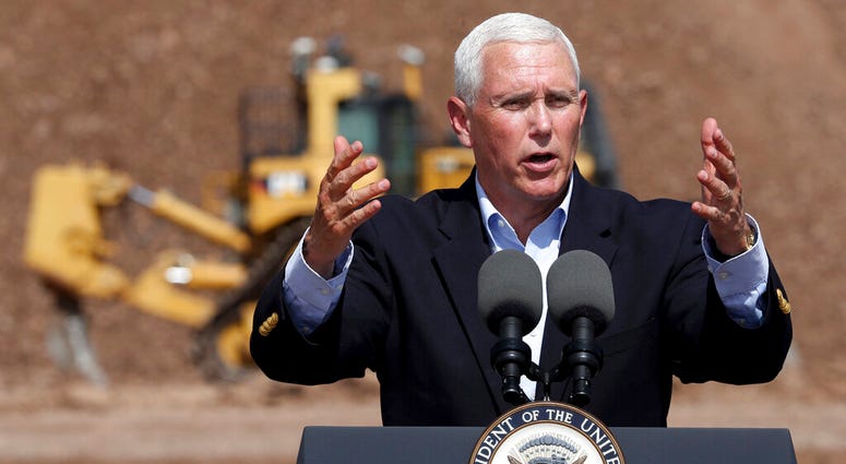 Vice President Mike Pence talks to the gathered employees of Caterpillar during a visit to the Tinaja Hills Demonstrations and Learning Center, Green Valley, Ariz., Thursday, Oct. 3, 2019. (Kelly Presnell/Arizona Daily Star via AP)