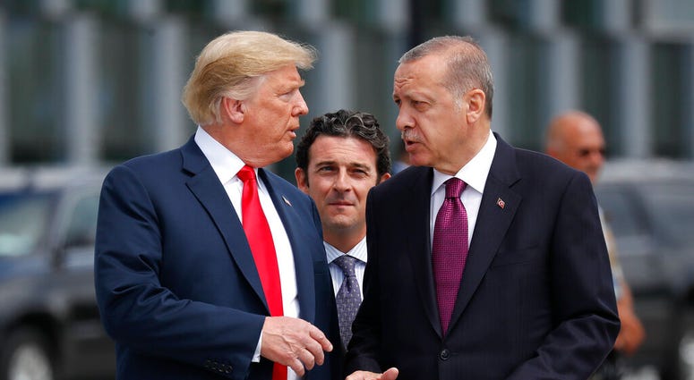 In this Wednesday, July 11, 2018, file photo, President Donald Trump, left, talks with Turkey's President Recep Tayyip Erdogan. (AP Photo/Pablo Martinez Monsivais, File)
