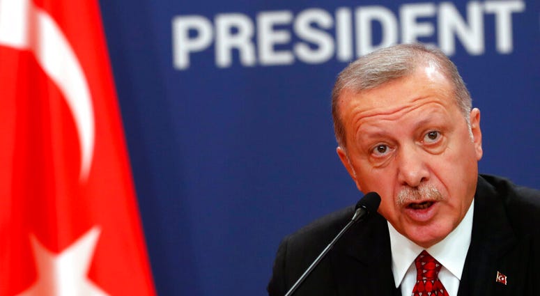 Turkey's President Recep Tayyip Erdogan speaks during a joint news conference after talks with his Serbian counterpart Aleksandar Vucic in Belgrade, Serbia, Monday, Oct. 7, 2019. (AP Photo/Darko Vojinovic)