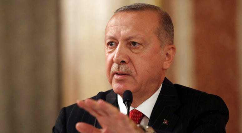 Turkey's President Recep Tayyip Erdogan addresses a conference of parliament speakers in Istanbul, Friday, Oct. 11, 2019. (Presidential Press Service via AP, Pool)