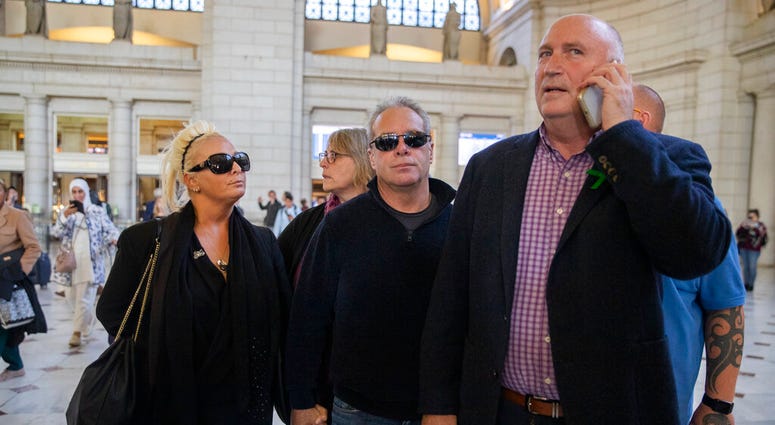 Charlotte Charles, left, mother of British teenager Harry Dunn, and her husband Bruce Charles, center arrive at Union Station in Washington, Tuesday, Oct. 15, 2019. (AP Photo/Manuel Balce Ceneta)