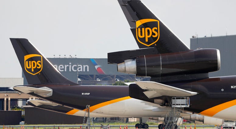 In this June 24, 2019, photo workers prepare to unload a UPS aircraft after it arrived at Dallas-Fort Worth International Airport in Grapevine, Texas. United Parcel Service Inc. reports financial earns on Tuesday, Oct. 22, 2019. (AP Photo/Tony Gutierrez) In this June 24, 2019, photo workers prepare to unload a UPS aircraft after it arrived at Dallas-Fort Worth International Airport in Grapevine, Texas. United Parcel Service Inc. reports financial earns on Tuesday, Oct. 22, 2019. (AP Photo/Tony Gutierrez)