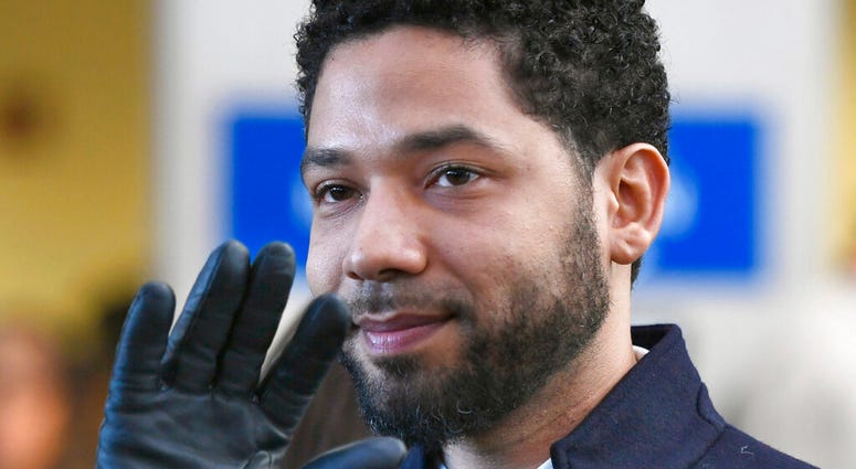 FILE - In this March 26, 2019 file photo, actor Jussie Smollett smiles and waves to supporters before leaving Cook County Court after his charges were dropped in Chicago. (AP Photo/Paul Beaty, File) FILE - In this March 26, 2019 file photo, actor Jussie Smollett smiles and waves to supporters before leaving Cook County Court after his charges were dropped in Chicago. (AP Photo/Paul Beaty, File)
