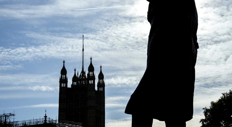 The statue of former Prime Minister Sir Winston Churchill stands in Parliament Square, in London, Monday, Oct. 28, 2019. (AP Photo/Alberto Pezzali)