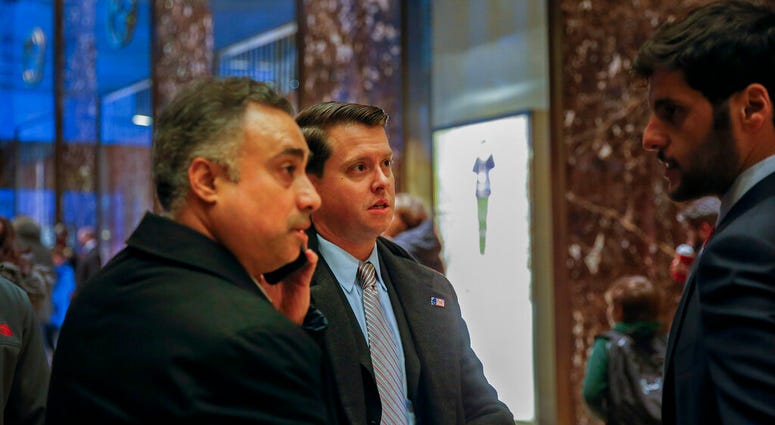 In this Dec. 12, 2016 photo, Los Angeles venture capitalist Imaad Zuberi, far left, arrives at Trump Tower in New York. Zuberi agreed this month to plead guilty to making illegal campaign contributions on behalf of foreign nationals and concealing his wor