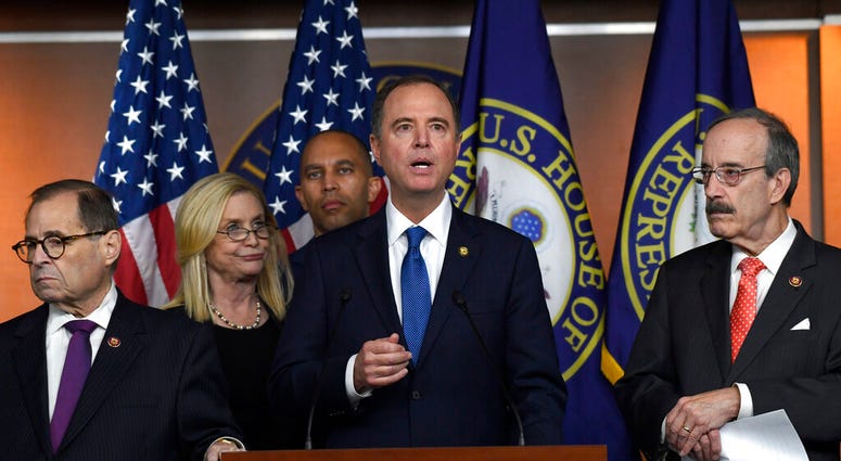 House Intelligence Committee Chairman Adam Schiff, D-Calif., second from right, speaks during a news conference on Capitol Hill.