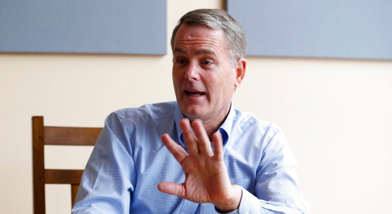 In this Jan. 3, 2019 file photo investor and Democratic donor Michael Bills gestures during an interview in Charlottesville, Va. (AP Photo/Steve Helber, File)