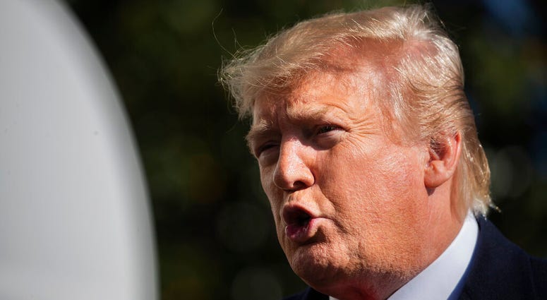 President Donald Trump speaks to reporters upon arrival at the White House in Washington, Sunday, Nov. 3, 2019. (AP Photo/Manuel Balce Ceneta)