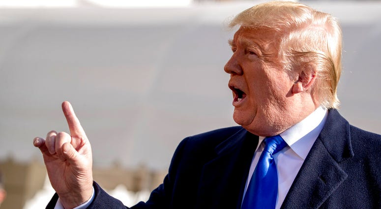 President Donald Trump tells a reporter to be quiet as he speaks on the South Lawn of the White House in Washington, Friday, Nov. 8, 2019, before boarding Marine One. (AP Photo/Andrew Harnik)