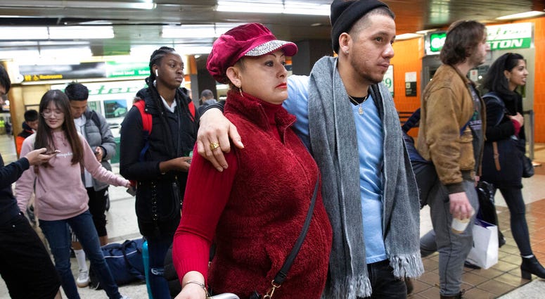 Luz Aurora Vidal and her son, Martín Batalla Vidal, line up to take a bus to Washington, Monday, Nov. 11, 2019, in New York. (AP Photo/Mark Lennihan)