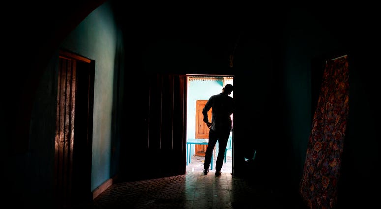 In this Aug. 23, 2019, photo, a Honduran father stands at his home in Comayagua, Honduras, after talking in an interview about being separated from his 3-year-old daughter. (AP Photo/Elmer Martinez)
