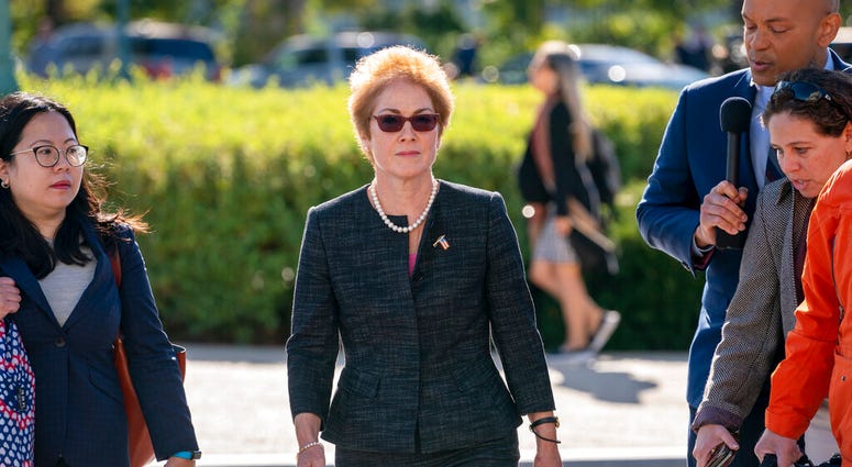 In this Oct. 11, 2019, file photo, former U.S. ambassador to Ukraine Marie Yovanovitch, center, arrives on Capitol Hill, Friday, Oct. 11, 2019, in Washington. (AP Photo/J. Scott Applewhite, File)