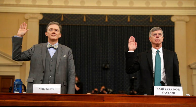 Career Foreign Service officer George Kent and top U.S. diplomat in Ukraine William Taylor, right, are sworn in to testify. (AP Photo/Andrew Harnik)