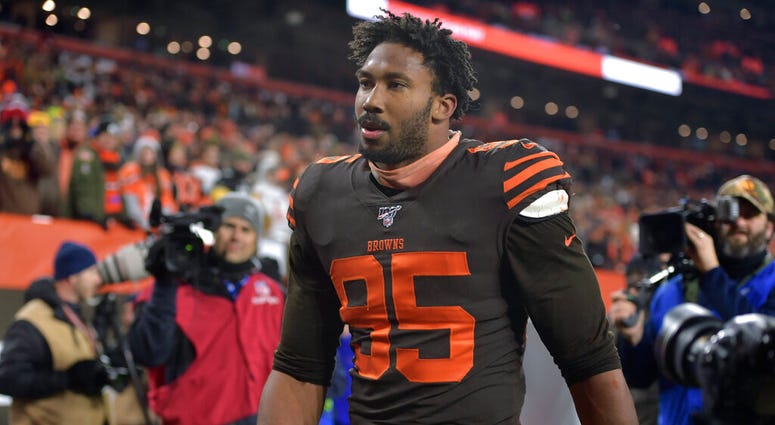 Cleveland Browns defensive end Myles Garrett walks off the field after he was ejected late in the fourth quarter. (AP Photo/David Richard)