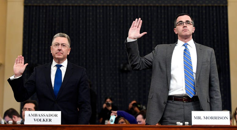 Ambassador Kurt Volker, left, former special envoy to Ukraine, and Tim Morrison, a former official at the National Security Council are sworn in to testify. (AP Photo/Susan Walsh)