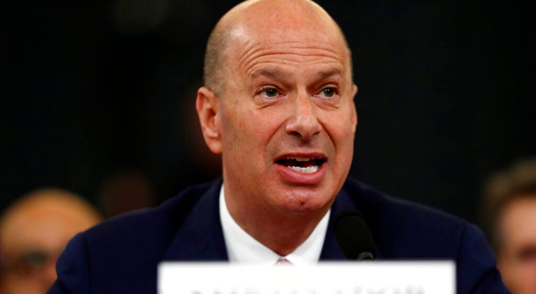 U.S. Ambassador to the European Union Gordon Sondland gives his opening statement as he testifies before the House Intelligence Committee on Capitol Hill in Washington, Wednesday, Nov. 20, 2019. (AP Photo/Andrew Harnik)