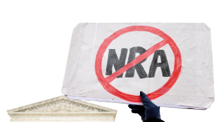 Protesters gather outside the Supreme Court in Washington, Monday, Dec. 2, 2019, during arguments in the first gun rights case before the Supreme Court in nine years. (AP Photo/Susan Walsh) Protesters gather outside the Supreme Court in Washington, Monday, Dec. 2, 2019, during arguments in the first gun rights case before the Supreme Court in nine years.