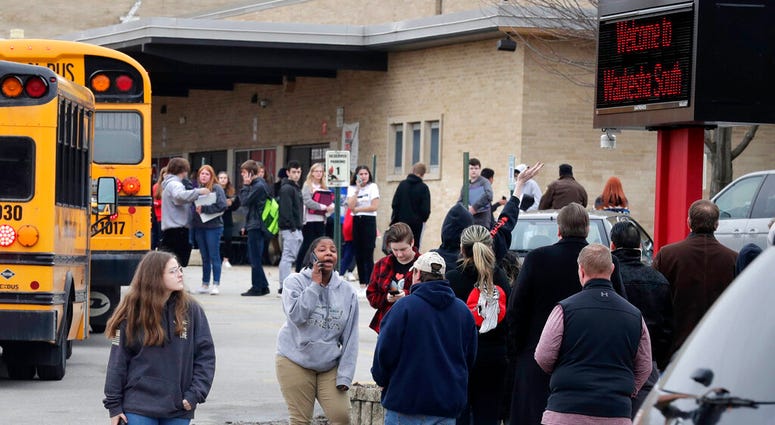 Waukesha South High School students find their waiting parents and friends and hug after they leave the building following shots fired inside the school, Monday, December 2, 2019. (Rick Wood/Milwaukee Journal-Sentinel via AP) Waukesha South High School students find their waiting parents and friends and hug after they leave the building following shots fired inside the school, Monday, December 2, 2019.