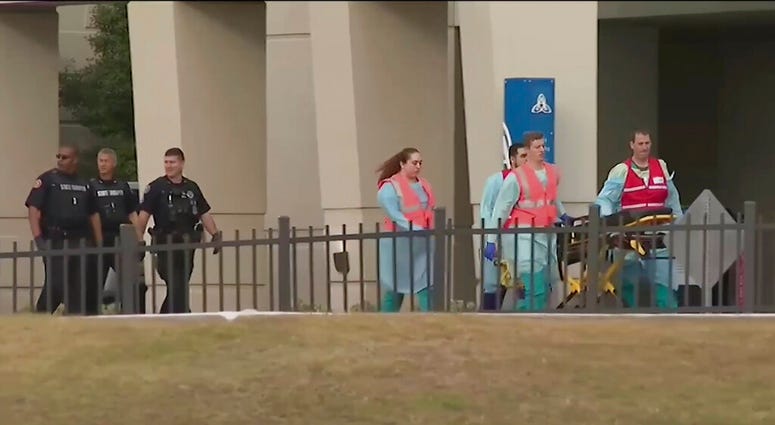 This photo taken from video provided by WEAR-TV shows emergency responders near the Naval Air Base Station in Pensacola, Fla., Friday, Dec. 6, 2019. (WEAR-TV via AP) This photo taken from video provided by WEAR-TV shows emergency responders near the Naval Air Base Station in Pensacola, Fla., Friday, Dec. 6, 2019. (WEAR-TV via AP)