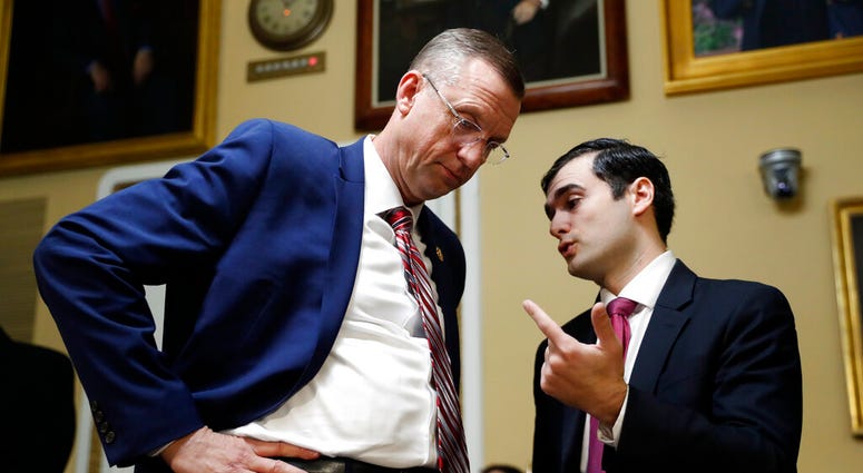 House Judiciary Committee ranking member Rep. Doug Collins, R-Ga., speaks to an aide before a House Rules Committee hearing on the impeachment against President Donald Trump, Tuesday, Dec. 17, 2019, on Capitol Hill in Washington. House Judiciary Committee ranking member Rep. Doug Collins, R-Ga., speaks to an aide before a House Rules Committee hearing on the impeachment against President Donald Trump, Tuesday, Dec. 17, 2019, on Capitol Hill in Washington.