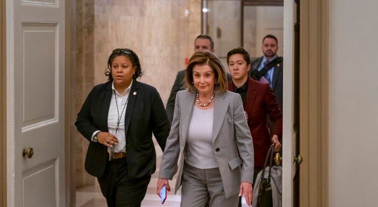 Speaker of the House Nancy Pelosi, D-Calif., arrives at the Capitol in Washington, Friday, Jan. 10, 2020.