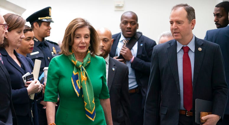 Speaker of the House Nancy Pelosi, D-Calif., joined by House Intelligence Committee Chairman Adam Schiff, D-Calif., leaves a closed-door meeting with the Democratic Caucus at the Capitol, Tuesday, Jan. 14, 2020. (AP Photo/J. Scott Applewhite) Speaker of the House Nancy Pelosi, D-Calif., joined by House Intelligence Committee Chairman Adam Schiff, D-Calif., leaves a closed-door meeting with the Democratic Caucus at the Capitol, Tuesday, Jan. 14, 2020. (AP Photo/J. Scott Applewhite)