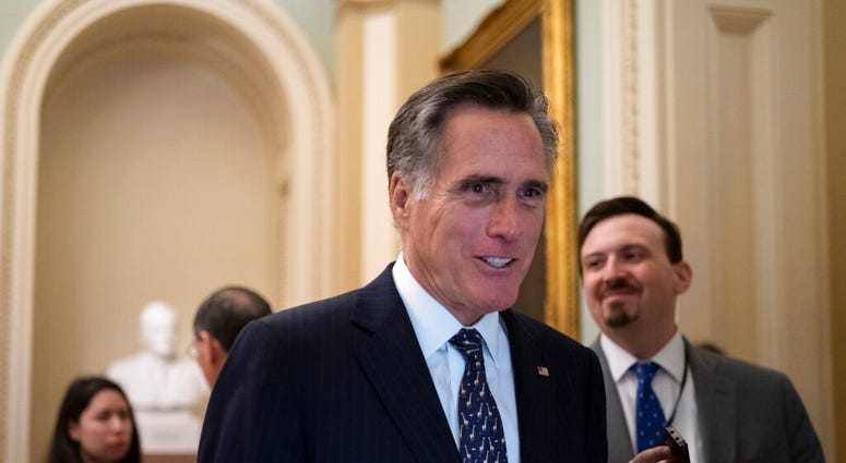 Sen. Mitt Romney, R-Utah, arrives at the Senate for a Republican lunch before work resumes in the impeachment trial of President Donald Trump on charges of abuse of power and obstruction of Congress. (AP Photo/J. Scott Applewhite) Sen. Mitt Romney, R-Utah, arrives at the Senate for a Republican lunch before work resumes in the impeachment trial of President Donald Trump on charges of abuse of power and obstruction of Congress. (AP Photo/J. Scott Applewhite)