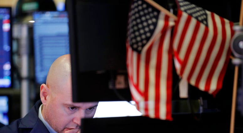 In this Jan. 8, 2020, file photo a trader works on the floor at the New York Stock Exchange in New York. (AP Photo/Seth Wenig, File) In this Jan. 8, 2020, file photo a trader works on the floor at the New York Stock Exchange in New York. (AP Photo/Seth Wenig, File)