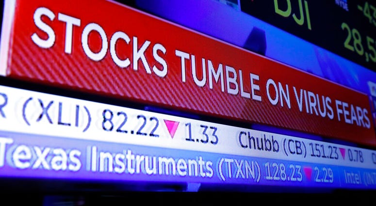A television screen headlines trading on the floor of the New York Stock Exchange, Monday, Jan. 27, 2020. (AP Photo/Richard Drew) A television screen headlines trading on the floor of the New York Stock Exchange, Monday, Jan. 27, 2020. (AP Photo/Richard Drew)