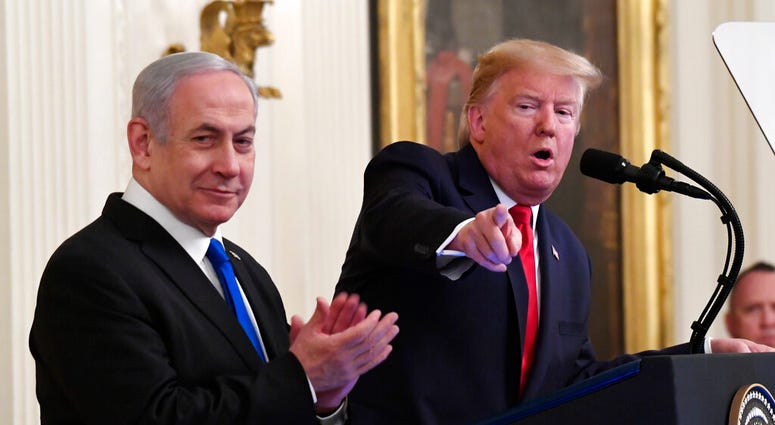 President Donald Trump speaks during an event with Israeli Prime Minister Benjamin Netanyahu in the East Room of the White House in Washington, Tuesday, Jan. 28, 2020. (AP Photo/Susan Walsh) President Donald Trump speaks during an event with Israeli Prime Minister Benjamin Netanyahu in the East Room of the White House in Washington, Tuesday, Jan. 28, 2020. (AP Photo/Susan Walsh)