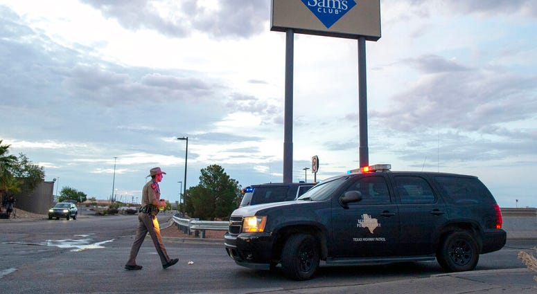In this Aug. 4, 2019 file photo, a Texas State Trooper walks back to his car while providing security outside the Walmart store in the aftermath of a mass shooting in El Paso, Texas. (AP Photo/Andres Leighton) In this Aug. 4, 2019 file photo, a Texas State Trooper walks back to his car while providing security outside the Walmart store in the aftermath of a mass shooting in El Paso, Texas. (AP Photo/Andres Leighton)