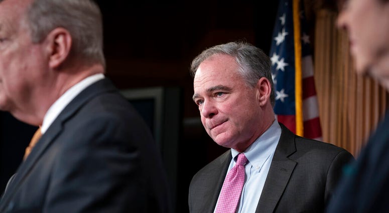 Sen. Tim Kaine, D-Va., and a group of bipartisan senators meet with reporters. (AP Photo/J. Scott Applewhite) Sen. Tim Kaine, D-Va., and a group of bipartisan senators meet with reporters. (AP Photo/J. Scott Applewhite)