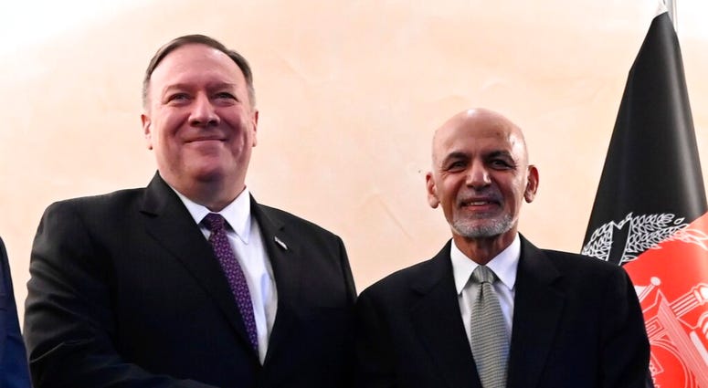 US Secretary of State Mike Pompeo, left, shakes hands with Afghan President Ashraf Ghani,during the 56th Munich Security Conference (MSC) in Munich, southern Germany, on Friday, Feb. 14, 2020. (Andrew Caballero-Reynolds/Pool photo via AP) US Secretary of State Mike Pompeo, left, shakes hands with Afghan President Ashraf Ghani,during the 56th Munich Security Conference (MSC) in Munich, southern Germany, on Friday, Feb. 14, 2020. (Andrew Caballero-Reynolds/Pool photo via AP)